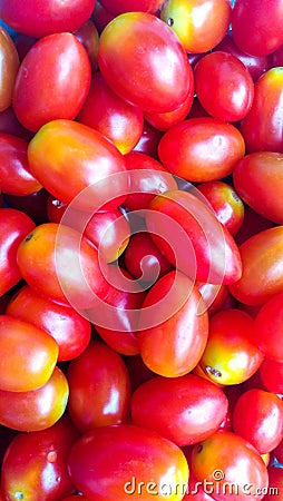 Pile of many fresh red cherry tomatoes Stock Photo