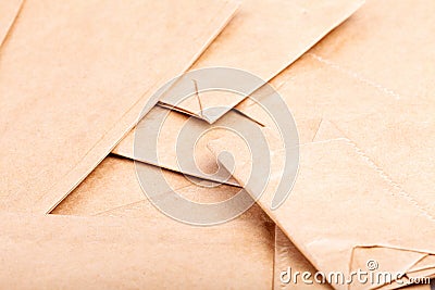 A pile of many small brown eco new paper recyclable food bags detail abstract background texture pattern macro, closeup Stock Photo