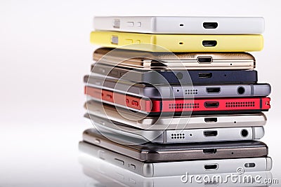 Pile of mobile phone. Heap of the different smartphones. Stock Photo