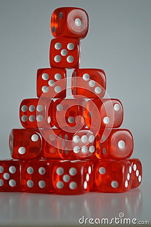 Pile of multiple red plastic arcylic d6 six sided die dice variable focus Stock Photo