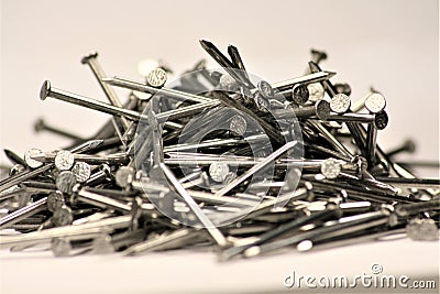 Pile of Nails fallen out of the Box lying on the Ground Stock Photo