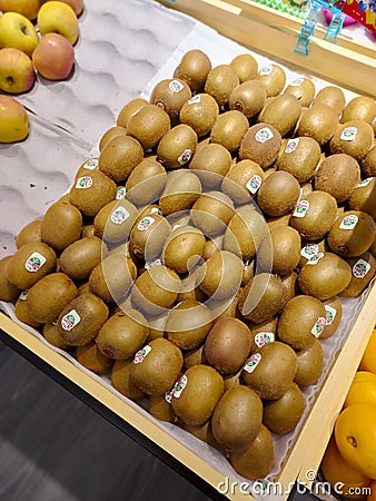 Pile of New Zealand Zespri gold kiwifruit in the fruit section of the supermarket Editorial Stock Photo