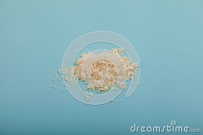 Pile of Nisin powder on blue surface, selective focus. Food additive E234, extremely effective against yeast and fungi even at Stock Photo