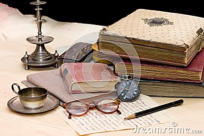 Pile of old books and different things Stock Photo