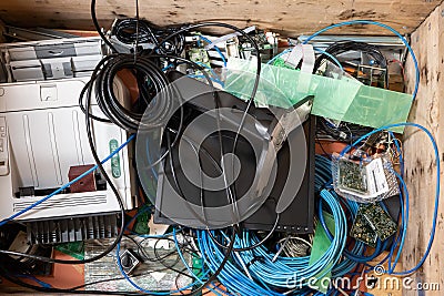 Pile of old electronic devices and cables ready for waste collection or recycling, no people Stock Photo