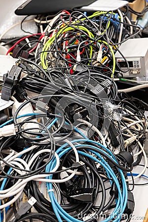 Pile of old electronic devices and cables ready for waste collection or recycling, no people Stock Photo