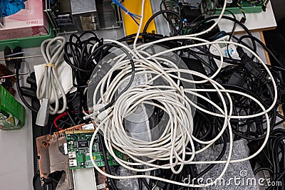 Pile of old electronic devices and cables ready for waste collection or recycling, no people Stock Photo