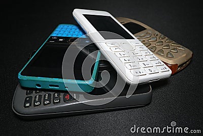 Pile of old gen mobile phones devices,technology evolution concept Stock Photo