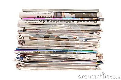 Pile of old newspapers and magazines, stack, side view, isolated on white background Stock Photo