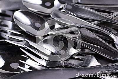 Old scratched and dull flatware in need of polishing Stock Photo