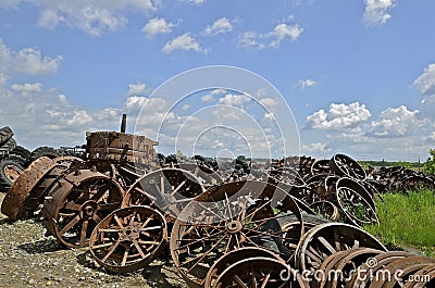 Pile of old steam engines wheels for salvage. Stock Photo