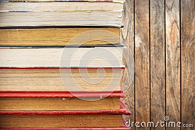 Pile of old vintage books, wooden background Stock Photo