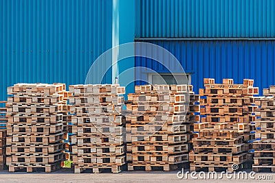 Pile of old wooden pallet by the plant Stock Photo