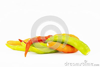 Pile of orange,yellow and green chilli isolated on white background Stock Photo