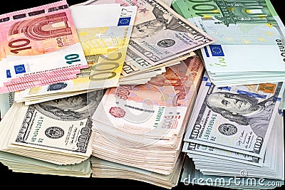 Pile of paper money three currencies Stock Photo