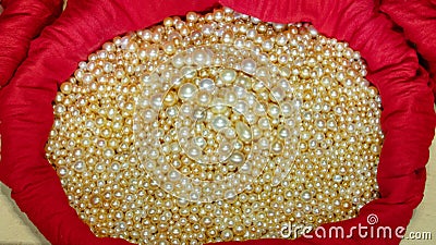 Pile of Pearls in the red cloth at a shop in Qatar.. Selective focus Stock Photo