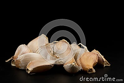Pile piece of fresh garlic group ingredient isolated on black background Stock Photo