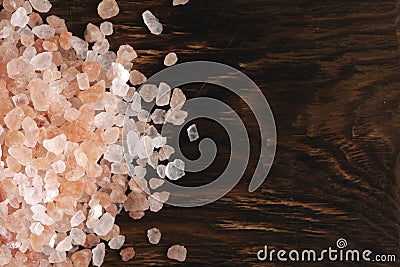 Pile of pink salt wooden background. Stock Photo