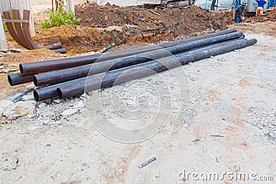 pile pipes black repair water On the ground. Stock Photo