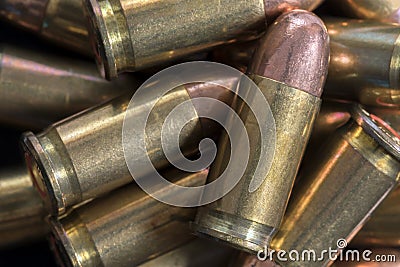 Pile of Pistol Bullets Background Stock Photo