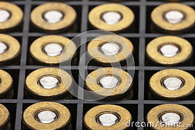 Pile of pistol bullets. The concept of limiting the spread of small arms Stock Photo