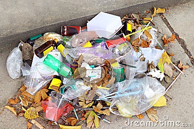 Pile of plastic garbage on the floor, garbage plastic waste glass and straws, plastic bag waste, plastic bottle drink waste trash Stock Photo