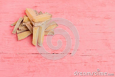 pile potato dry pink wood background. rotten Stock Photo