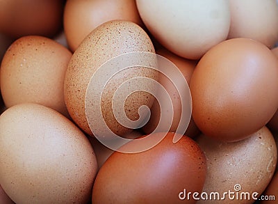 A Pile of Raw Fresh Brown Chicken Eggs Background Stock Photo