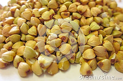 Pile of raw green buckwheat close up view. Vegan or vegetarian nutrition diet. Stock Photo