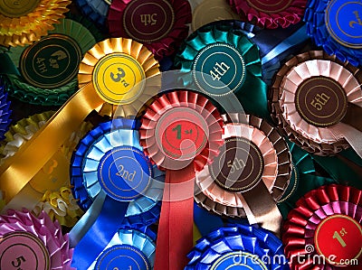 Pile of real rosettes badges with first, second third and fourth in the centre Stock Photo
