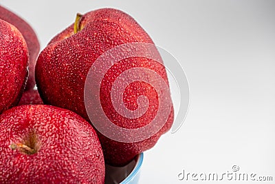 Pile of red appl with clear water drop on shell surface texture pattern isolated Stock Photo