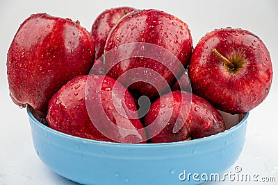 Pile of red appl with clear water drop on shell surface texture pattern isolated Stock Photo