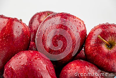 Pile of red appl with clear water drop on shell surface texture pattern isolated Stock Photo