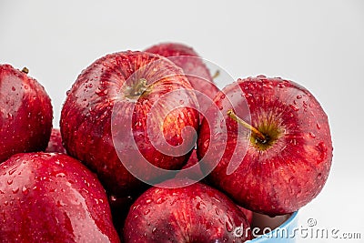Pile of red appl with clear water drop on shell surface texture pattern isolated Stock Photo