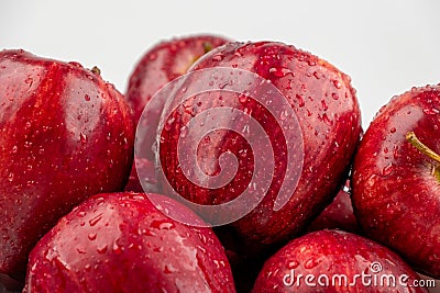 Pile of red appl with clear water drop on shell surface texture pattern isolated Stock Photo