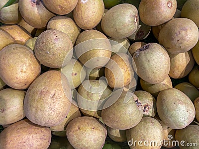 Pile of ripe Sapodilla fruit at tropical fruit store Stock Photo