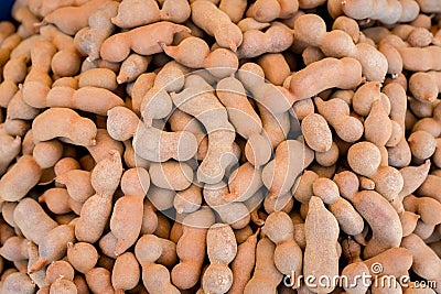 Pile of ripe Tamarind fruits.Sweet ripe tamarinds. Tamarind fruit Background. A big pile of tamarinds use for background or wallpa Stock Photo