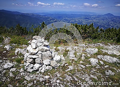 Pile of rocks on mountain trail in Carpathian mountains , Romania Stock Photo