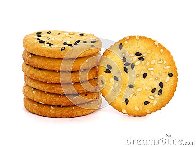 Pile of round sesame crackers isolated on white Stock Photo