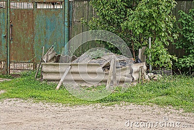 A pile of rubble fenced with pieces of gray slate Stock Photo