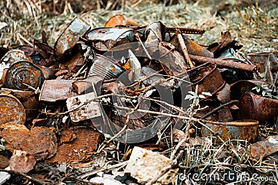 Pile rusty cans garbage on nature Stock Photo