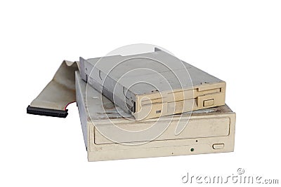 Pile of rusty, old and obsolete computer hardware, like a CD-ROM, floppy disk, isolated on a white background Stock Photo