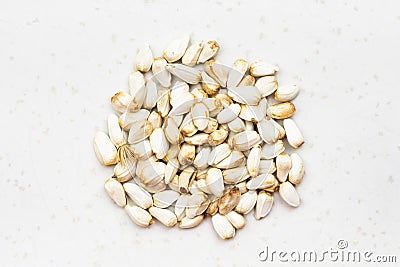 Pile of safflower seeds close up on gray Stock Photo