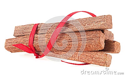 Pile of sandalwood sticks isolated on white background. Sandalwood pieces. Chandan Stock Photo