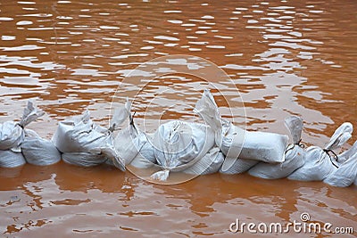 Pile of sandbags in defense from the flood Stock Photo