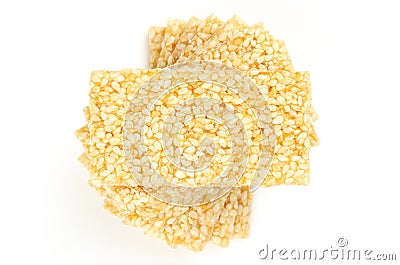 Pile of sesame brittle bars, sesame seed candy from above, over white Stock Photo