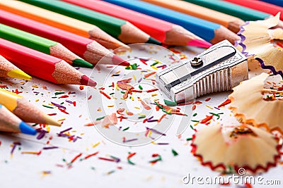 Pile of sharp coloured drawing pencils on table. Stock Photo