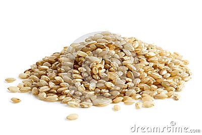 Pile of short grain brown rice. Stock Photo