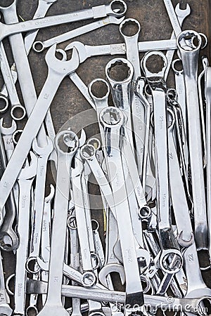 Pile of stainless steel wrench on table Stock Photo