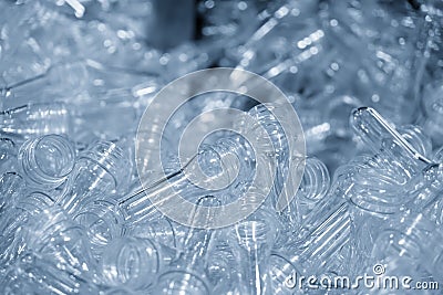 The pile of tube preform shape plastic bottles. Stock Photo